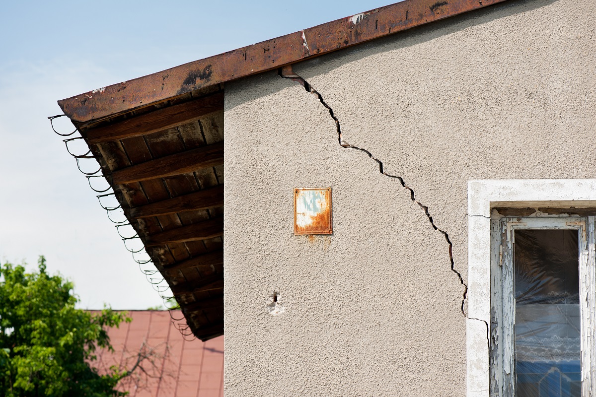 A house with cracks in the exterior wall